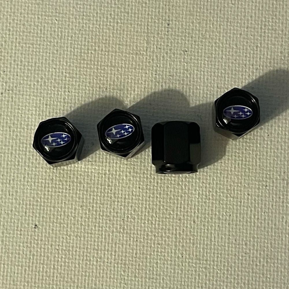 Subaru logo valve Stem caps in black set of 4 NWT